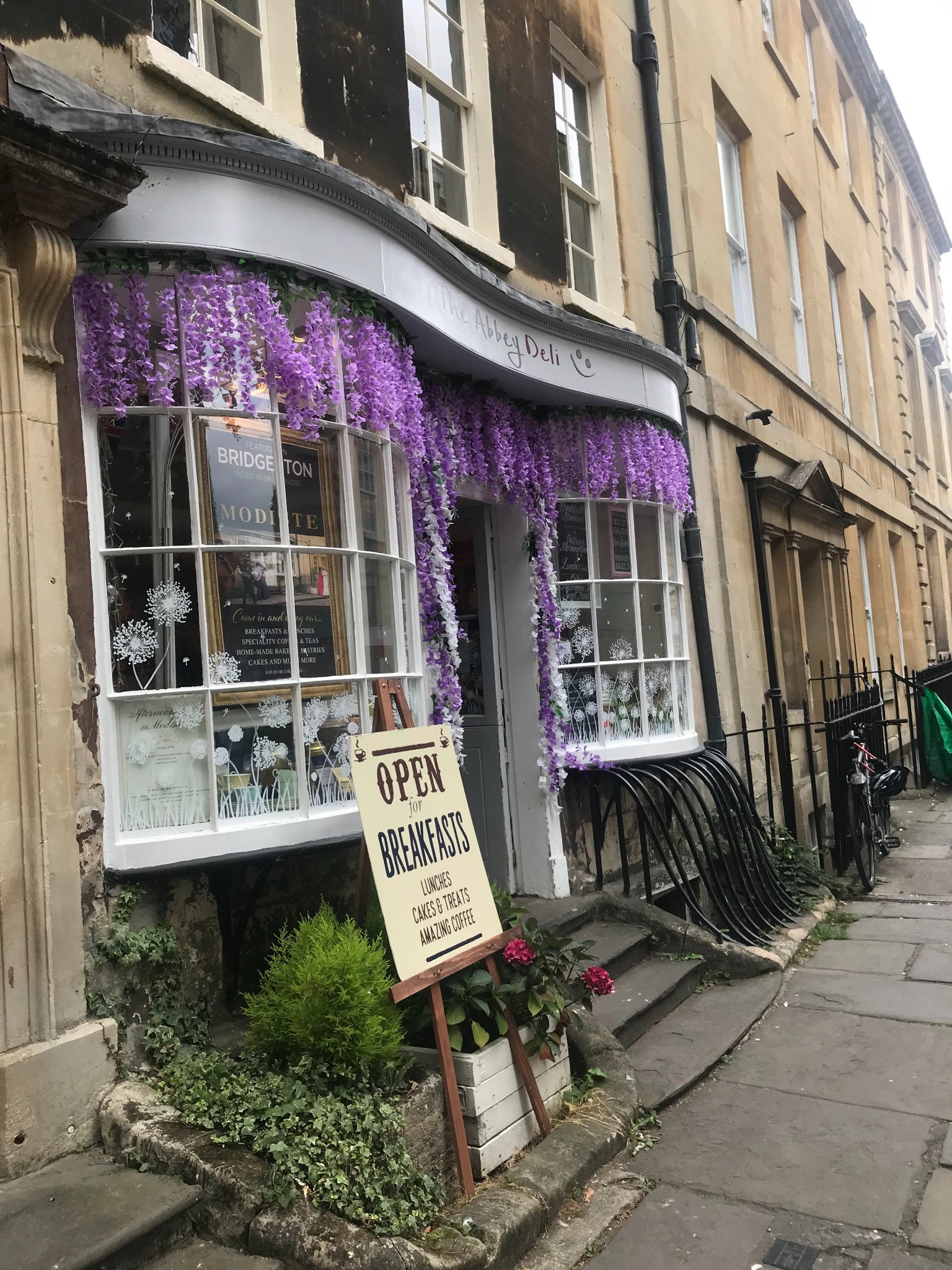 Historic Bath shopfront with wisteria